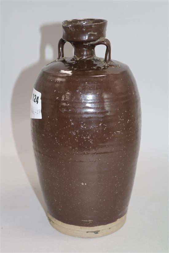 A Chinese late Ming brown glazed spouted jar